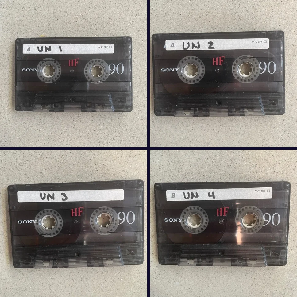 Four Sony HF 90 cassette tapes hand-labeled UN 1, UN 2, UN 3 and UN 4 — Phil Kline’s original Unsilent Night tapes